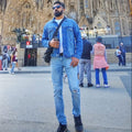 Person standing in front of the Sagrada Familia in Barcelona